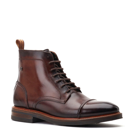 Lofting cap toe clearance boot